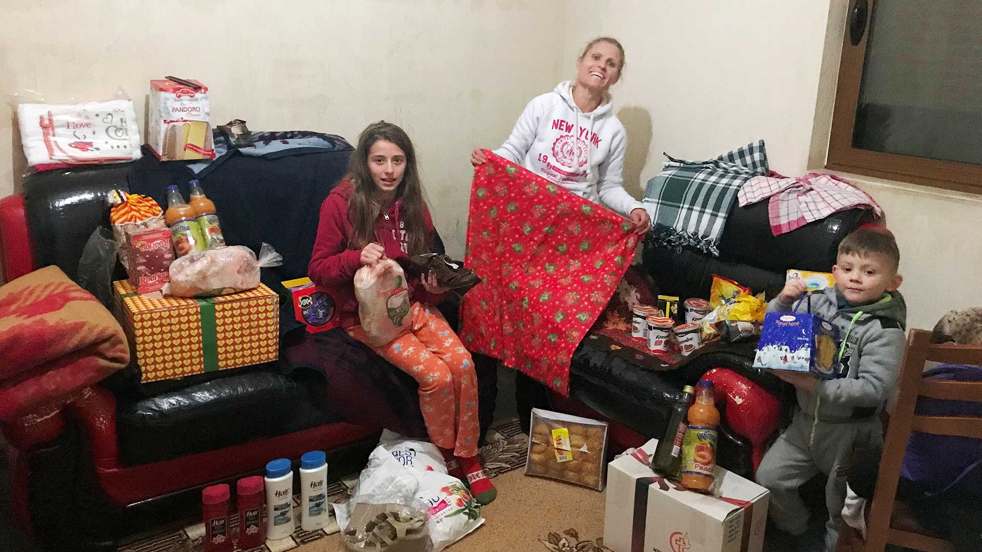 A family enjoy Christmas gifts.